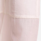 Close View of a Model wearing Off-White Hand Beaded Cotton Elasticated Wide Legged Pant