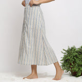 Left View of a Model wearing Handspun Off-White Button-Down Skirt