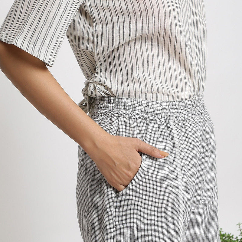 Right Detail of a Model Wearing Handspun Striped Top and Checkered Pant Set