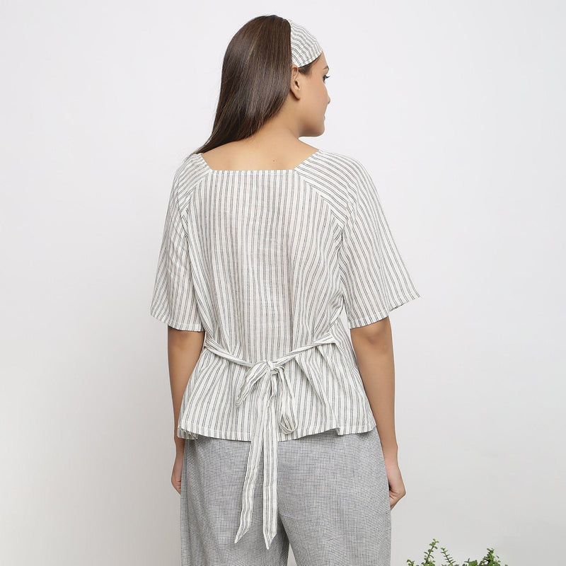 Back View of a Model Wearing Handspun Striped Top and Checkered Pant Set