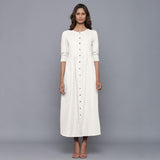 Front View of a Model wearing Off-White Cotton Flannel Gathered Dress