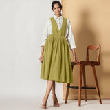 Front View of a Model Wearing Olive Green Cotton Flax Pinafore Midi Wrap Dress