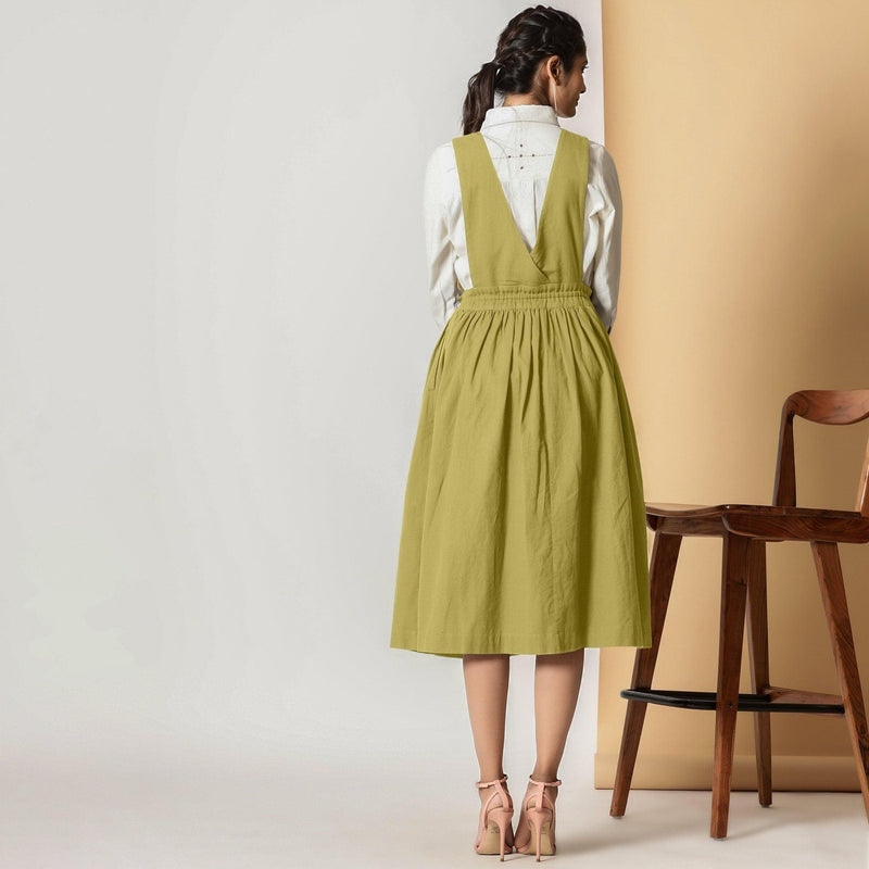 Back View of a Model Wearing Olive Green Cotton Flax Pinafore Midi Wrap Dress