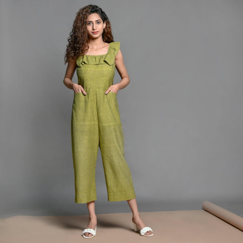 Front View of a Model wearing Olive Green Handspun Cotton Frilled Jumpsuit