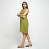 Left View of a Model wearing Olive Green Criss-Cross Cotton A-Line Dress