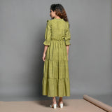 Back View of a Model wearing Olive Green Handspun Cotton Beaded Boho Dress