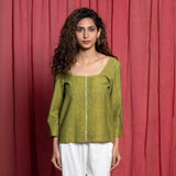 Front View of a Model wearing Olive Green Square Neck Handspun Cotton Hand Beaded Top