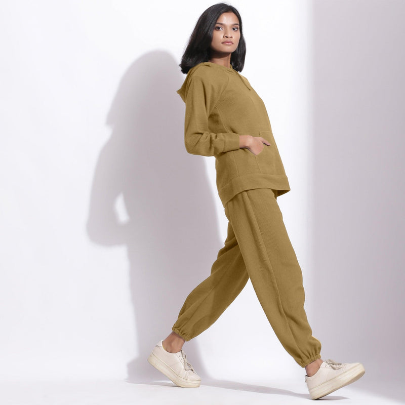 Right View of a Model wearing Olive Green Sweatshirt and Jogger Pant Set