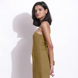 Left View of a Model wearing Olive Green Honeycomb One-Shoulder Jumpsuit