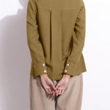 Back Detail of a Model wearing Olive Green Waffle Button-Down Pocket Shirt