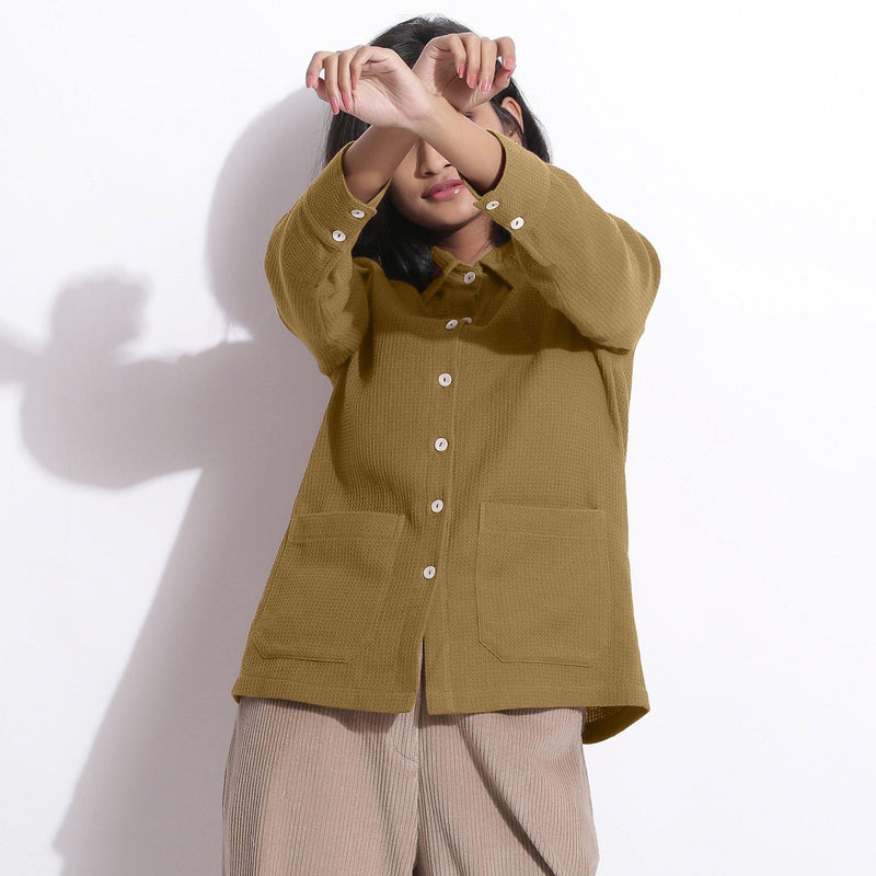 Front View of a Model wearing Olive Green Waffle Button-Down Pocket Shirt