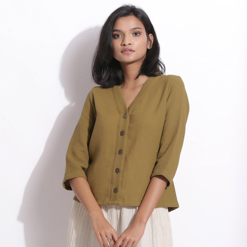 Front View of a Model wearing Olive Green Cotton Waffle Button-Down Top