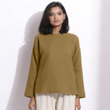 Front View of a Model wearing Olive Green Cotton Waffle Drop Shoulder Top