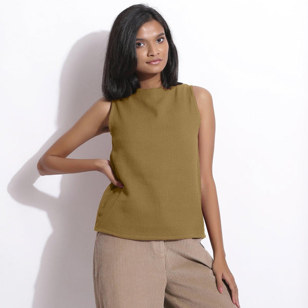 Front View of a Model wearing Olive Cotton Waffle Funnel Neck Top