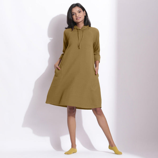 Front View of a Model wearing Cotton Waffle Olive Green Hoodie Dress