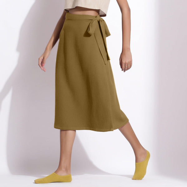 Left View of a Model wearing Olive Green Cotton Waffle Wrap Skirt