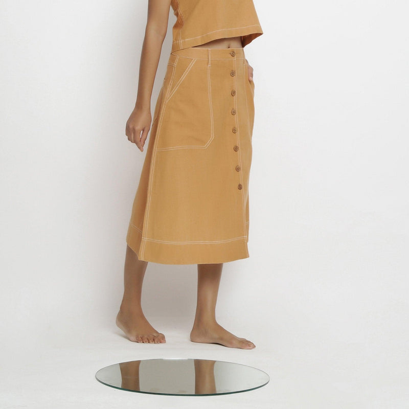 Right View of a Model wearing Rustic Vegetable Dyed Cotton Button-Down Midi Skirt