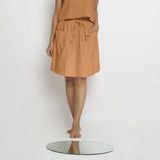 Front View of a Model wearing Vegetable-Dyed Rust 100% Cotton Mid-Rise Skirt