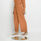 Left View of a Model wearing Rust Patch Pocket Straight Fit Pant