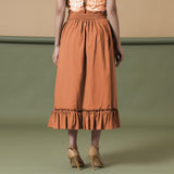 Back View of a Model wearing Orange A-Line Ruffled Cotton Skirt