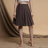 Front View of a Model wearing Orange and Brown Reversible Pleated Flared Skirt