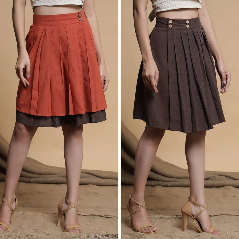 Front View of a Model wearing Orange and Brown Reversible Pleated Flared Skirt