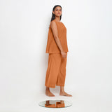 Right View of a Model wearing Orange A-Line Top and Rustic Pant Set