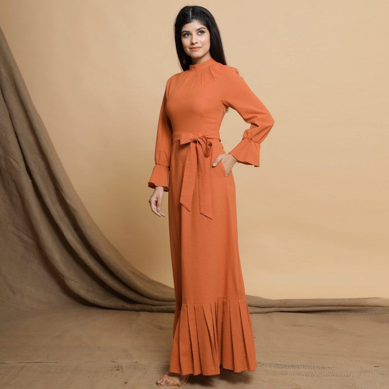 Left View of a Model wearing Orange Floor Length Pleated Tier Dress