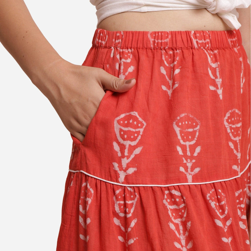 Right Detail of a Model wearing Orange Gathered Floral Maxi Skirt