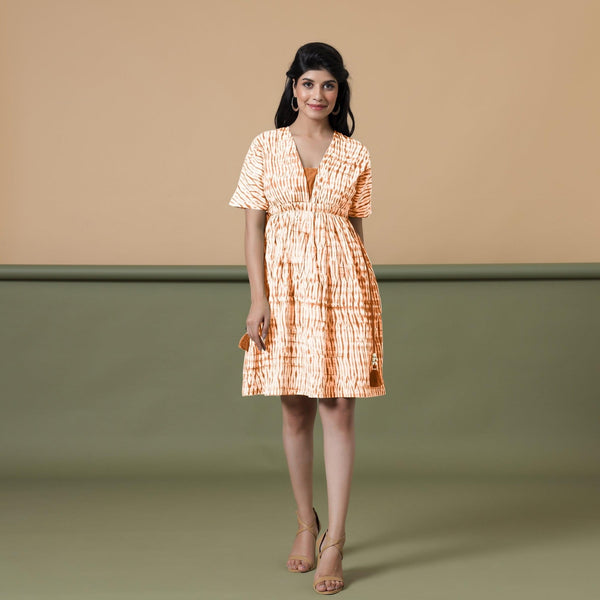 Front View of a Model wearing Orange Green Shibori Drop Shoulder Dress