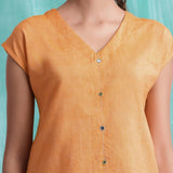 Front Detail of a Model wearing Orange Hand Mirror Work Drop Shoulder Top