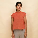 Front View of a Model wearing Orange Ruffled Neck 100% Cotton Flared Top