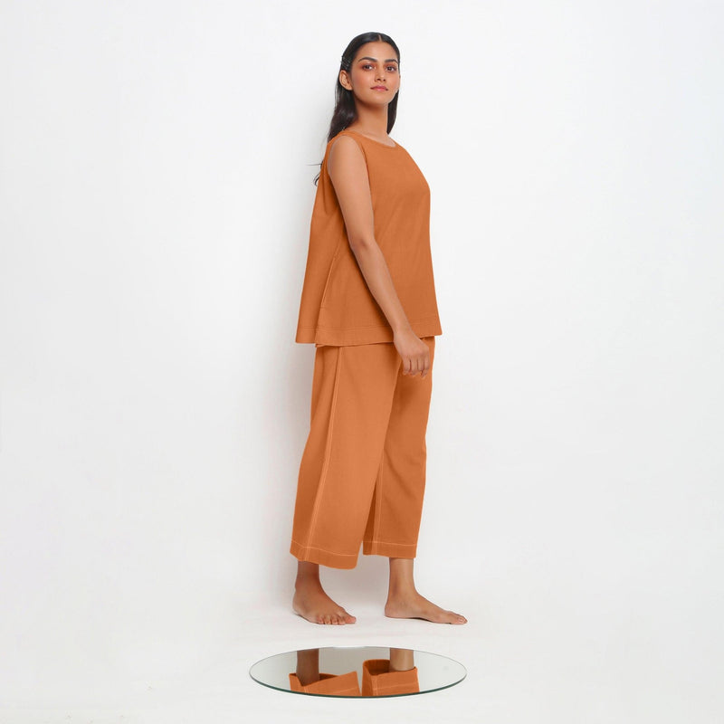 Right View of a Model wearing Vegetable-Dyed Orange 100% Cotton A-Line Top