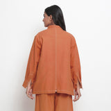 Back View of a Model wearing Rust Vegetable Dyed Handspun Cotton Button-Down Jacket