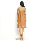 Back View of a Model wearing Rust Vegetable Dyed Handspun Slip Dress