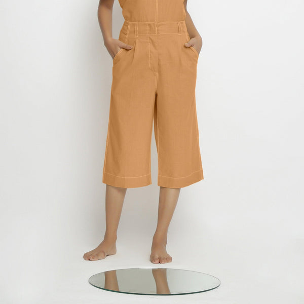 Front View of a Model wearing Vegetable Dyed Orange 100% Cotton Mid-Rise Culottes