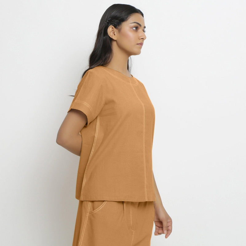 Right View of a Model wearing Vegetable-Dyed Orange 100% Cotton Paneled Top