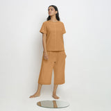 Front View of a Model wearing Vegetable-Dyed Orange 100% Cotton Paneled Top