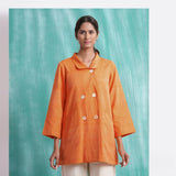 Front View of a Model wearing Handwoven Orange Welt Pocket Coat