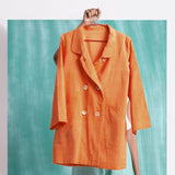 Front View of a Handwoven Orange Welt Pocket Coat