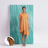 Front View of a Model wearing Orange Mirrored Asymmetrical Shirt Dress