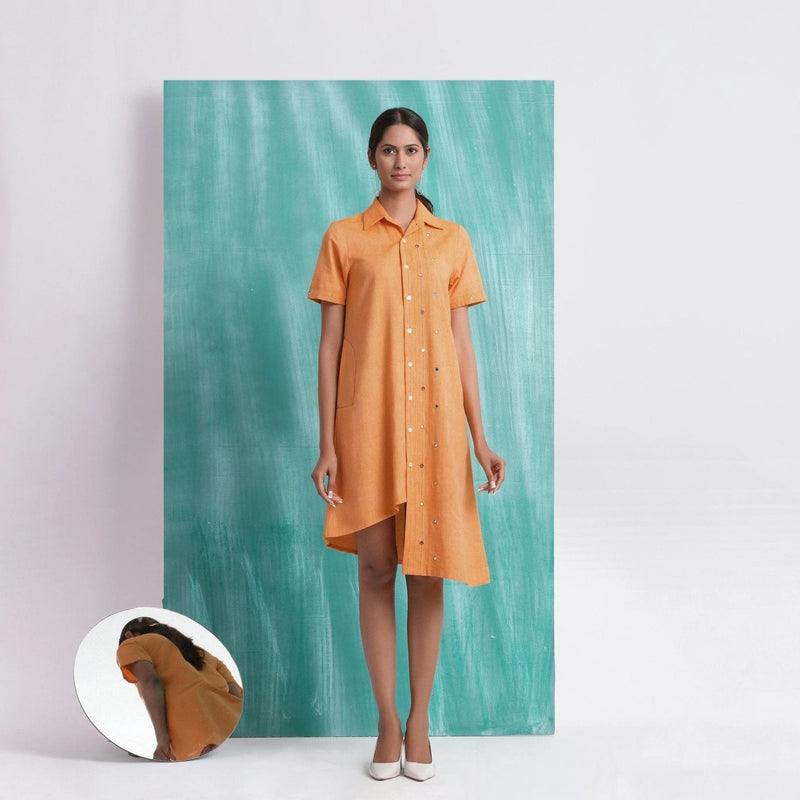 Front View of a Model wearing Orange Mirrored Asymmetrical Shirt Dress