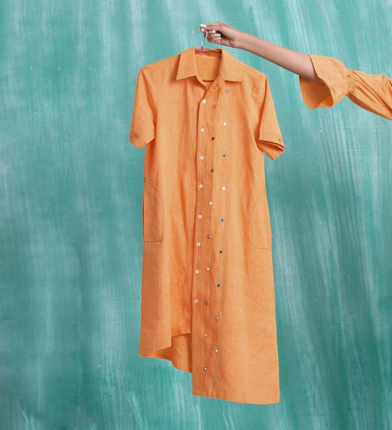 Front View of a Model wearing Orange Mirrored Asymmetrical Shirt Dress