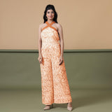 Front View of a Model wearing Shibori Flared Top and Sunset Orange Pant Set