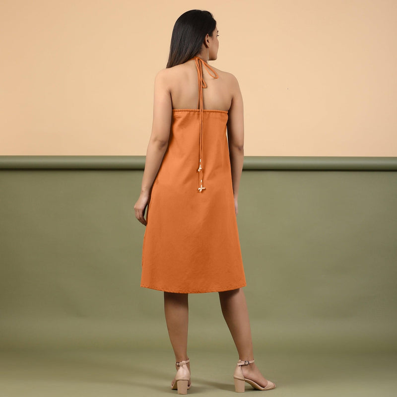 Back View of a Model wearing Orange Shibori Halter Neck A line Dress