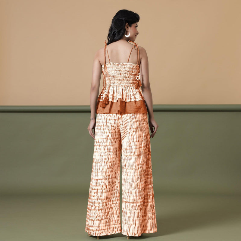 Back View of a Model wearing Orange Shibori Tier Camisole Top