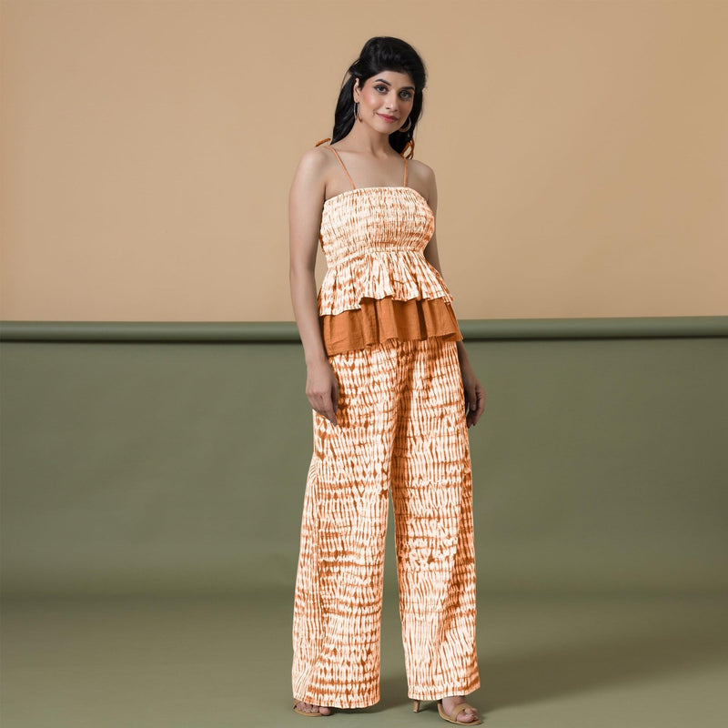 Right View of a Model wearing Orange Shibori Wide Legged Cotton Pant