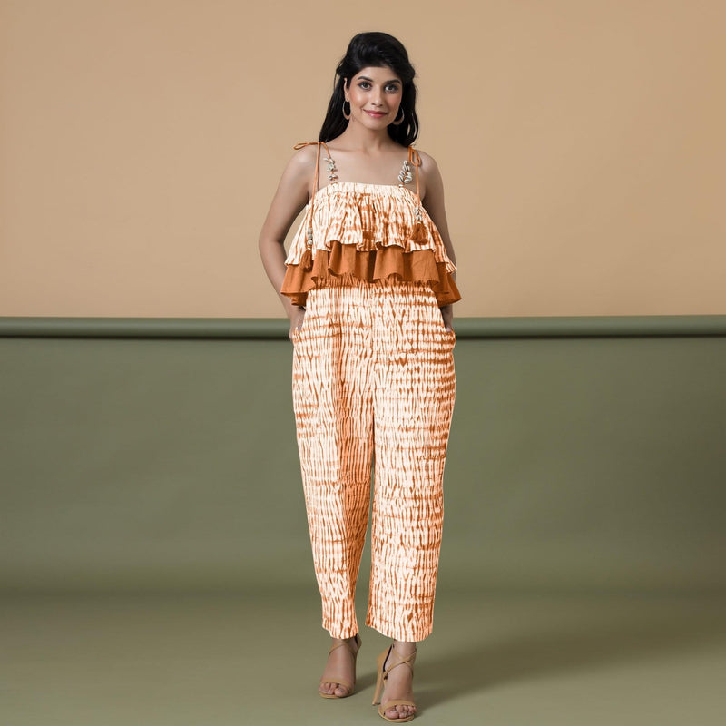 Front View of a Model wearing Orange Shibori Frilled Camisole Jumpsuit