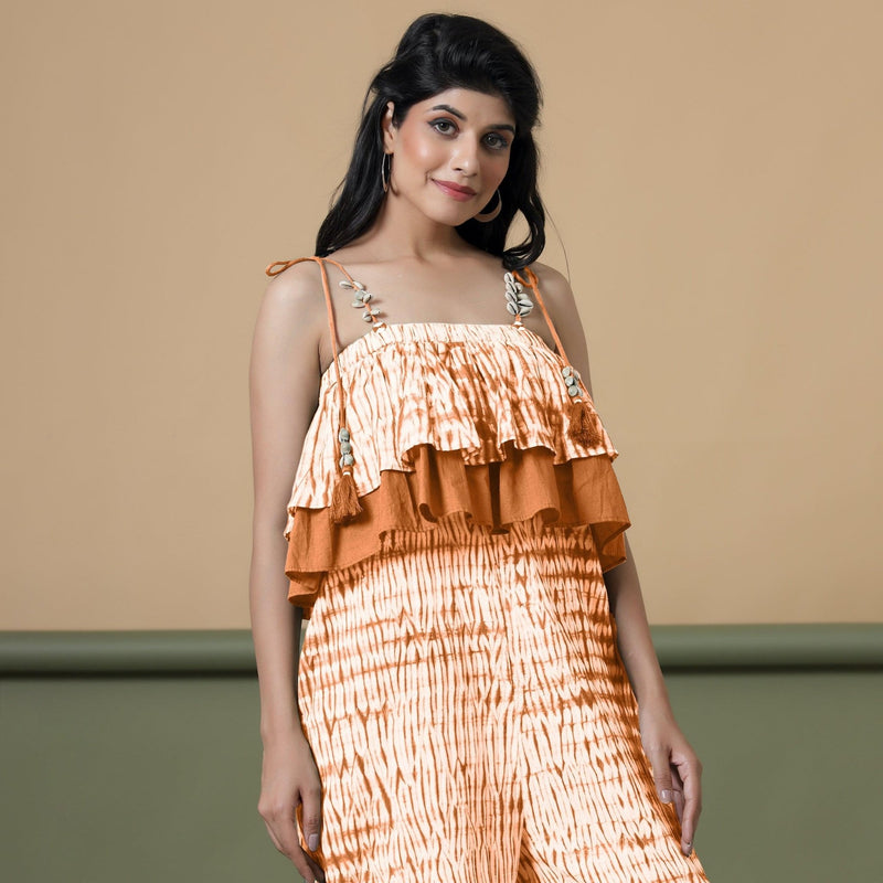 Front View of a Model wearing Orange Shibori Frilled Camisole Jumpsuit