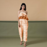 Front View of a Model wearing Orange Shibori Frilled Camisole Jumpsuit